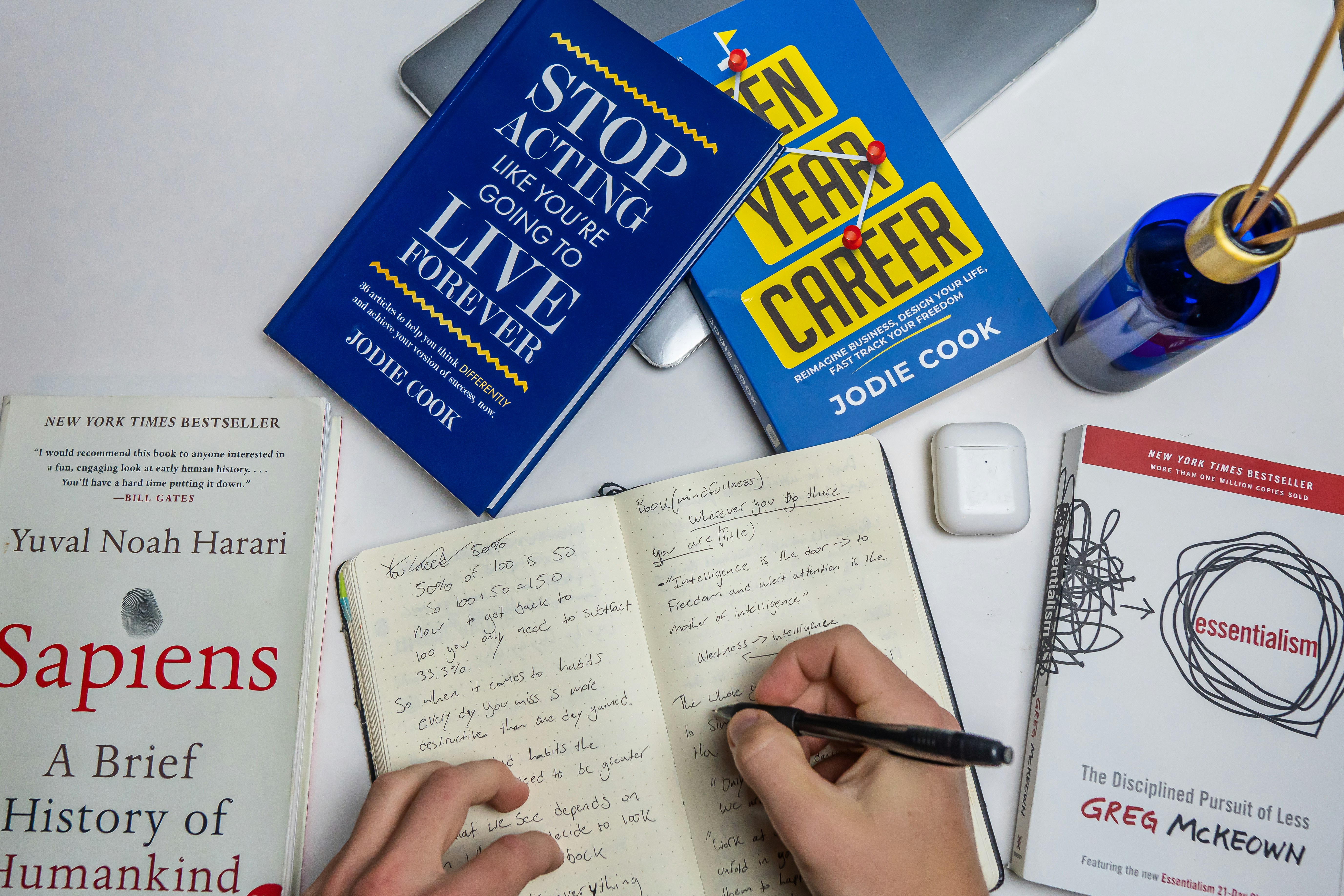 A large stack of diverse books, representing stories ready for screen adaptation.